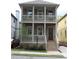 Charming two-story home with a welcoming front porch and a well-maintained landscaped yard at 106 Hogue St, Atlanta, GA 30312