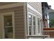 Exterior side view showing the tan siding, white trim, and backyard deck at 106 Hogue St, Atlanta, GA 30312