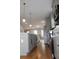 Modern kitchen with stainless steel appliances, gray cabinets and hardwood floors at 106 Hogue St, Atlanta, GA 30312