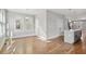 Bright, open-concept living area featuring hardwood floors and modern lighting fixtures at 106 Hogue St, Atlanta, GA 30312