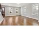 Open living area with hardwood floors and large windows offering plenty of natural light and staircase access at 106 Hogue St, Atlanta, GA 30312