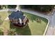 Brick home aerial view featuring large manicured lawn and backyard deck at 3240 Letha Woods Sw Dr, Conyers, GA 30094