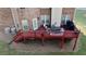Outdoor deck area complete with outdoor furniture set, dining table, BBQ grill, and brick exterior home at 3240 Letha Woods Sw Dr, Conyers, GA 30094