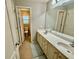 Spacious bathroom with double vanity, tile floor and excellent lighting at 3240 Letha Woods Sw Dr, Conyers, GA 30094