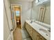Bathroom featuring double sinks, vanity with storage, toilet, and tile floor at 3240 Letha Woods Sw Dr, Conyers, GA 30094
