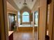 Luxurious bathroom featuring a soaking tub under an arched window, with separate water closet and shower at 3240 Letha Woods Sw Dr, Conyers, GA 30094