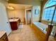 Spacious bathroom features a large vanity, jacuzzi tub, and natural light at 3240 Letha Woods Sw Dr, Conyers, GA 30094