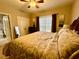 Comfortable bedroom with ceiling fan, window, TV, and ensuite bathroom at 3240 Letha Woods Sw Dr, Conyers, GA 30094