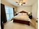 Bedroom with neutral tones, large windows, ceiling fan and ensuite bathroom at 3240 Letha Woods Sw Dr, Conyers, GA 30094