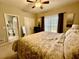 Comfortable bedroom with large window, ensuite bathroom and ceiling fan at 3240 Letha Woods Sw Dr, Conyers, GA 30094