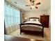 Bright bedroom with ceiling fan, and curtains for ample light control at 3240 Letha Woods Sw Dr, Conyers, GA 30094