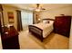 Cozy bedroom featuring a beautiful wood bed frame, closet, and dresser at 3240 Letha Woods Sw Dr, Conyers, GA 30094