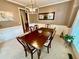 Dining area with stylish table, chairs, neutral walls, and ample natural light at 3240 Letha Woods Sw Dr, Conyers, GA 30094