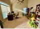 Home office featuring a desk area, high ceilings, large windows, decorative chairs, and plenty of space at 3240 Letha Woods Sw Dr, Conyers, GA 30094