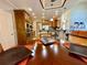 Open kitchen featuring wooden cabinetry, modern appliances, and bar-style seating at 3240 Letha Woods Sw Dr, Conyers, GA 30094