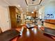 Spacious eat in kitchen with wood cabinetry, stainless steel appliances, and modern lighting at 3240 Letha Woods Sw Dr, Conyers, GA 30094