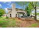 Home's backyard featuring a spacious deck and an outdoor entertainment area at 3969 Bear Ridge Nw Pl, Kennesaw, GA 30144