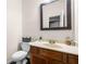 Cozy half-bath with single vanity, toilet, and framed mirror at 3969 Bear Ridge Nw Pl, Kennesaw, GA 30144