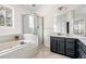 Primary bathroom featuring a tub, shower, and vanity with framed mirror at 3969 Bear Ridge Nw Pl, Kennesaw, GA 30144