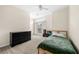 A simple bedroom features neutral walls, carpeted floors, and a window at 3969 Bear Ridge Nw Pl, Kennesaw, GA 30144