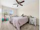 This bedroom features neutral walls, carpeted floors, and a window at 3969 Bear Ridge Nw Pl, Kennesaw, GA 30144