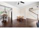 Open-concept dining area with hardwood floors, chandelier, and adjacent staircase at 3969 Bear Ridge Nw Pl, Kennesaw, GA 30144