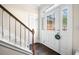 Inviting entryway with a decorative front door, staircase, and hardwood floors at 3969 Bear Ridge Nw Pl, Kennesaw, GA 30144