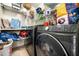 A fully-equipped laundry room with shelving and front-load washer and dryer at 3969 Bear Ridge Nw Pl, Kennesaw, GA 30144