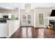 Bright living area featuring fireplace, hardwood floors, and outdoor access at 3969 Bear Ridge Nw Pl, Kennesaw, GA 30144