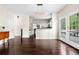 Open-concept living area with hardwood floors and access to outdoor patio at 3969 Bear Ridge Nw Pl, Kennesaw, GA 30144