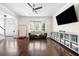 Spacious living room with hardwood floors, large windows, and a comfortable seating area at 3969 Bear Ridge Nw Pl, Kennesaw, GA 30144
