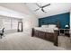 Main bedroom with carpet, vaulted ceilings, and accent wall at 3969 Bear Ridge Nw Pl, Kennesaw, GA 30144