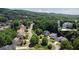 Aerial view of a home nestled within a lush, green neighborhood at 6765 Creek View Ln, Cumming, GA 30041