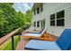 Enjoy backyard views from the deck with lounge seating for relaxing in the sun at 6765 Creek View Ln, Cumming, GA 30041