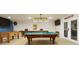 Recreational basement features a pool table, foosball table, and a shuffleboard table at 6765 Creek View Ln, Cumming, GA 30041