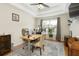 Well-lit home office offers a functional workspace and serene atmosphere at 6765 Creek View Ln, Cumming, GA 30041