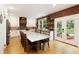 Large kitchen with marble countertops, an island, brick accents, and deck access at 6765 Creek View Ln, Cumming, GA 30041