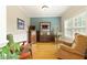 Cozy living room featuring hardwood floors, comfortable seating, and a bright, airy atmosphere at 6765 Creek View Ln, Cumming, GA 30041