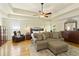 Generous main bedroom with hardwood floors, trey ceilings, a sitting area, and lots of natural light at 6765 Creek View Ln, Cumming, GA 30041