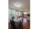 Cozy dining area adjacent to the kitchen with a table set for four at 102 Collins Way, Douglasville, GA 30134