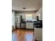 Well-equipped kitchen with stainless steel appliances and white cabinets at 102 Collins Way, Douglasville, GA 30134