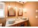 Bathroom featuring granite counters, unique vessel sinks, and modern lighting fixtures at 1336 Shirley Dr, Sugar Hill, GA 30518