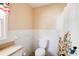 A cozy bathroom featuring a floral shower curtain and a single window at 1336 Shirley Dr, Sugar Hill, GA 30518