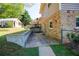 View of the home's brick exterior, patio, and fenced in yard at 1336 Shirley Dr, Sugar Hill, GA 30518