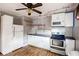 Kitchen featuring modern appliances, white cabinetry, and updated countertops at 1336 Shirley Dr, Sugar Hill, GA 30518