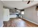 Open concept kitchen view featuring stainless steel appliances and hardwood floors at 1336 Shirley Dr, Sugar Hill, GA 30518