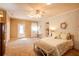 Large bedroom with a bed and bench, fireplace, closet space, and carpet flooring at 1336 Shirley Dr, Sugar Hill, GA 30518