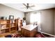 Home office with built-in bookshelves and a large wooden desk at 1336 Shirley Dr, Sugar Hill, GA 30518