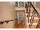 Stairway with ornate metal railing leading to the upper level of the home at 1336 Shirley Dr, Sugar Hill, GA 30518