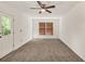 Bedroom with neutral carpeting, a window with wood blinds, and a door to the outside at 1878 Suwanee Roberts Ct, Lawrenceville, GA 30043